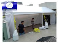 Anclaje de carpa con costales de lona